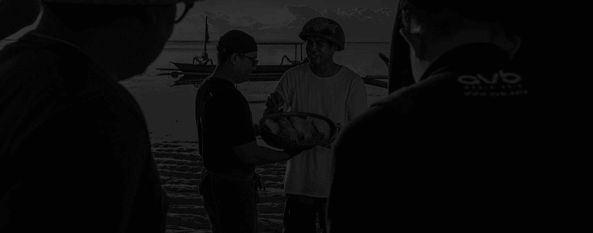 Team having a conversation by the water