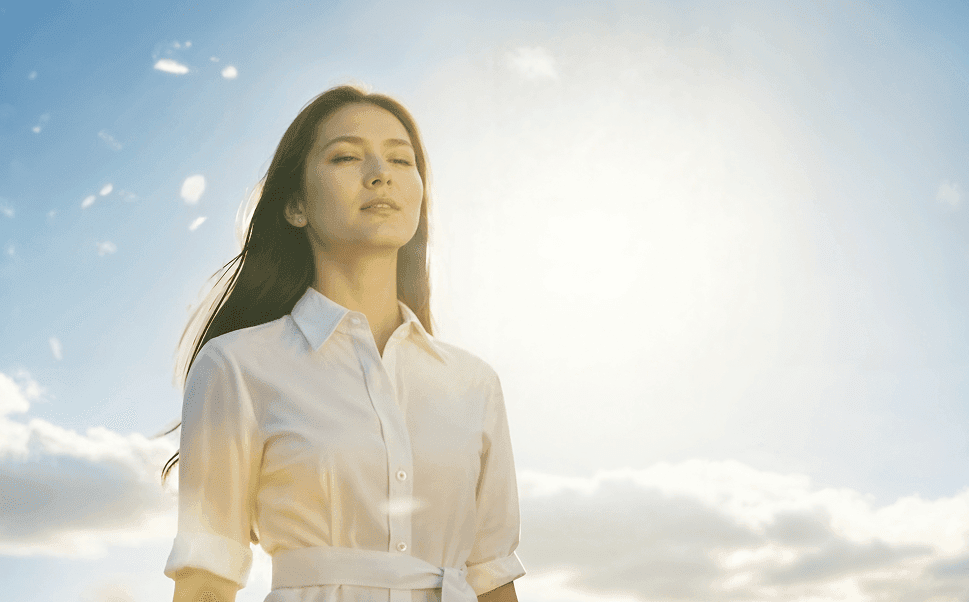 Woman standing under open sky